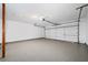 Attached garage with epoxy flooring and automatic door at 4496 Whitt Station Nw Run, Acworth, GA 30101