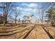 Two-story house with white siding, brown roof, and landscaping at 4496 Whitt Station Nw Run, Acworth, GA 30101