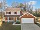 Two-story house with red shutters and attached garage at 4496 Whitt Station Nw Run, Acworth, GA 30101