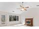 Living room features hardwood floors, brick fireplace and sliding glass doors at 4496 Whitt Station Nw Run, Acworth, GA 30101