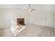 Living room with hardwood floors and a brick fireplace at 4496 Whitt Station Nw Run, Acworth, GA 30101