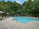 Community pool with lounge chairs and umbrellas at 713 Trevett Way, Marietta, GA 30062