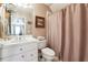 Bathroom with white vanity, toilet and shower at 786 Marshview Nw Ln, Kennesaw, GA 30152