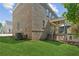 Brick exterior with a covered porch and green grass at 116 Cottage Gate Ln, Roswell, GA 30076