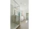 Contemporary bathroom with glass shower and tiled floors at 116 Cottage Gate Ln, Roswell, GA 30076