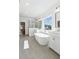 Beautiful bathroom featuring a soaking tub, tiled floors, and lots of light at 116 Cottage Gate Ln, Roswell, GA 30076
