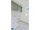 Bright laundry room showcasing ample gray storage cabinets and window with natural light at 116 Cottage Gate Ln, Roswell, GA 30076