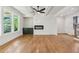Open-concept living room features a modern fireplace, sleek floors, and abundant natural light at 116 Cottage Gate Ln, Roswell, GA 30076