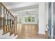 Spacious living room with hardwood floors, abundant natural light, and elegant ceiling at 116 Cottage Gate Ln, Roswell, GA 30076