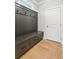 Hall tree bench offering storage and seating by the front door at 116 Cottage Gate Ln, Roswell, GA 30076