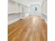 Spacious walk-in closet with custom shelving and hardwood floors at 116 Cottage Gate Ln, Roswell, GA 30076