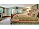 Large bedroom with light walls and floral bedding at 305 Carrolls Way, Fayetteville, GA 30215