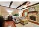 Primary bedroom with wood beams and stone fireplace at 305 Carrolls Way, Fayetteville, GA 30215