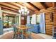 Charming dining room with wooden beams, chandelier, and blue accents at 305 Carrolls Way, Fayetteville, GA 30215
