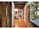 Charming entryway with terracotta tile floor and log cabin walls at 305 Carrolls Way, Fayetteville, GA 30215