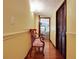 Charming hallway with hardwood floors and vintage bench at 305 Carrolls Way, Fayetteville, GA 30215