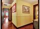 Bright hallway with wood floors and yellow walls at 305 Carrolls Way, Fayetteville, GA 30215