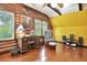 Cozy home office features wood walls, large windows, and built-in desk at 305 Carrolls Way, Fayetteville, GA 30215