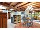 Rustic kitchen with wooden beams, light blue cabinets, and island at 305 Carrolls Way, Fayetteville, GA 30215