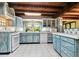 Updated kitchen features light blue cabinets and ample counter space at 305 Carrolls Way, Fayetteville, GA 30215