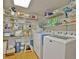 Convenient laundry room with washer, dryer, and ample shelving at 305 Carrolls Way, Fayetteville, GA 30215