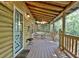 Spacious wooden porch with seating area and wooded views at 305 Carrolls Way, Fayetteville, GA 30215