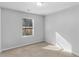 Simple bedroom with carpeted floor and a window at 8471 Douglas Trail, Jonesboro, GA 30236