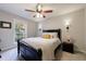 Serene bedroom with a queen-size bed, ceiling fan, and window at 3482 Essex Ave, Atlanta, GA 30339