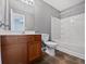 Clean bathroom with a tub, shower, and wood vanity at 2891 Vining Ridge Ter, Decatur, GA 30034