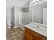 Clean bathroom with tub, shower, and wood vanity at 2891 Vining Ridge Ter, Decatur, GA 30034