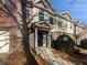 Brick front exterior of townhome with a covered entryway and walkway at 2891 Vining Ridge Ter, Decatur, GA 30034