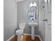 Simple powder room with pedestal sink and toilet at 2891 Vining Ridge Ter, Decatur, GA 30034