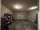 Spacious two car garage with overhead lighting, concrete floor, and ample storage at 3566 Andover Way, Buford, GA 30519