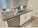 Kitchen with stainless steel dishwasher and white cabinets at 2786 Laurel Ridge Cir, East Point, GA 30344