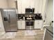 Modern kitchen with stainless steel appliances and white cabinets at 2786 Laurel Ridge Cir, East Point, GA 30344