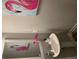 Stylish powder room with pedestal sink, decorative accents, and flamingo artwork at 2786 Laurel Ridge Cir, East Point, GA 30344
