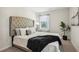 Main bedroom with tufted headboard and black accents at 643 Cygnet Ln, Grayson, GA 30017