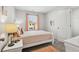 Bright bedroom with a double bed and coral accents at 643 Cygnet Ln, Grayson, GA 30017