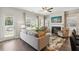 Spacious living room featuring a fireplace, hardwood floors, and ample natural light at 643 Cygnet Ln, Grayson, GA 30017