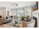Open concept living room with hardwood floors, fireplace, and access to patio at 643 Cygnet Ln, Grayson, GA 30017