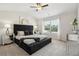 Spacious main bedroom with a king-size bed and high ceiling at 643 Cygnet Ln, Grayson, GA 30017