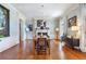 A dining room featuring hardwood floors and a fireplace at 5200 Moore Rd, Suwanee, GA 30024