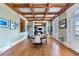 The dining room offers wood floors, coffered ceilings, with many windows and French doors at 5200 Moore Rd, Suwanee, GA 30024