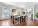 Bright and airy dining room featuring hardwood floors and elegant lighting at 5200 Moore Rd, Suwanee, GA 30024