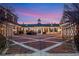 A long, private drive offers views of the extensive grounds and ample parking at 5200 Moore Rd, Suwanee, GA 30024