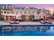 Luxury home boasts an outdoor pool, dual staircase and lounge area at 5200 Moore Rd, Suwanee, GA 30024