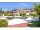 Luxurious home with a sparkling pool, stone patio and walkways, and professionally landscaped grounds at 5200 Moore Rd, Suwanee, GA 30024