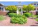 Elegant brick home featuring manicured landscaping, a brick walkway, and a covered front entrance with white columns at 5200 Moore Rd, Suwanee, GA 30024