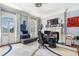 Bright home office with natural light, elegant fireplace, and ample space for productivity and creativity at 5200 Moore Rd, Suwanee, GA 30024