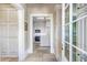 An open kitchen with a skylight, a central island, and white cabinets offering a bright and functional space at 5200 Moore Rd, Suwanee, GA 30024